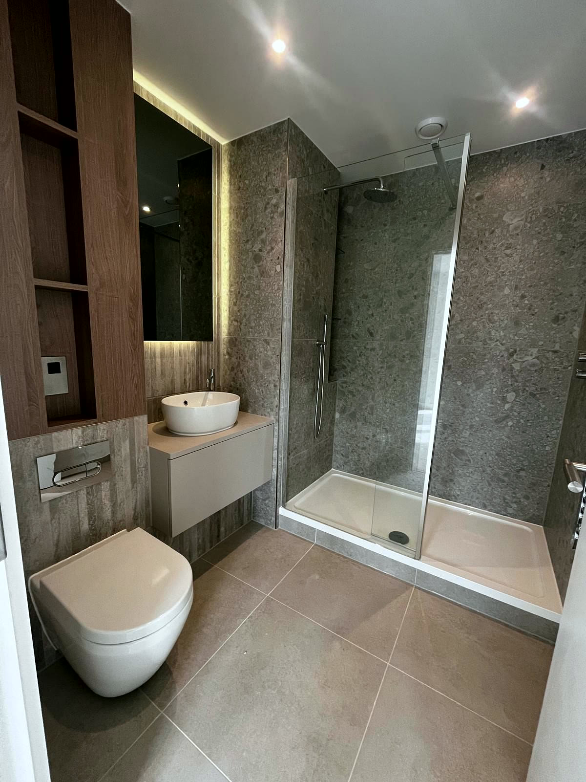 Shower room with large-format stone tiles and walk-in shower