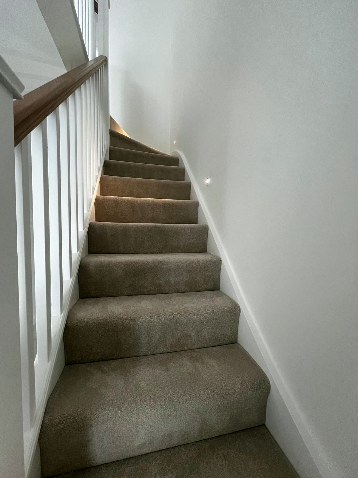 Carpeted staircase in a finished new home