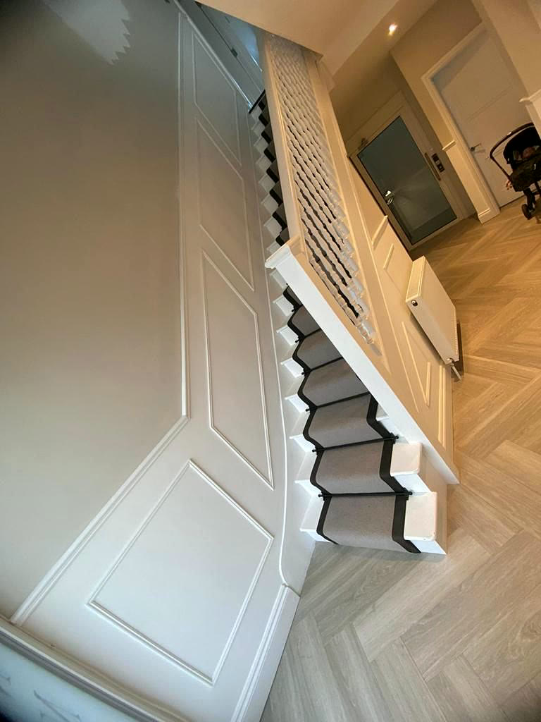 Staircase from above with panelled walls