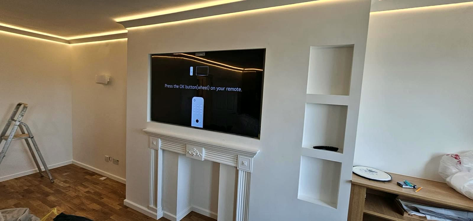 Living room feature wall with fireplace surround and niches