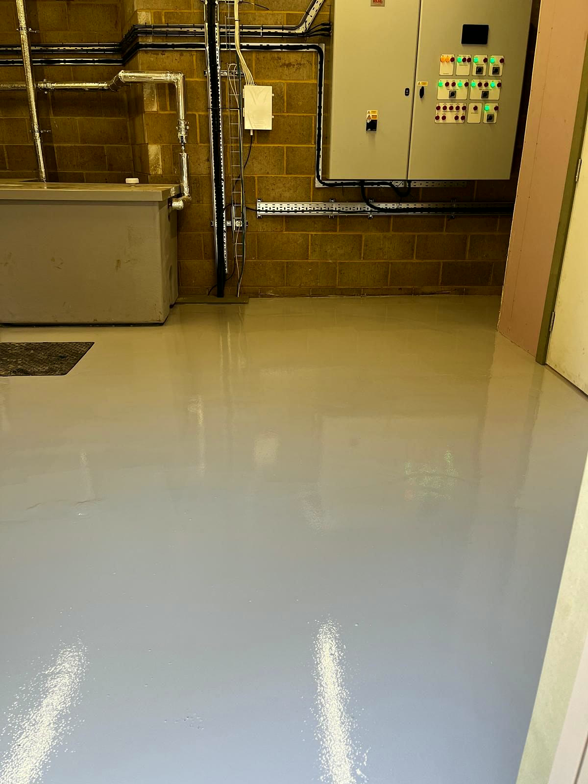 Freshly painted floor in a bin store